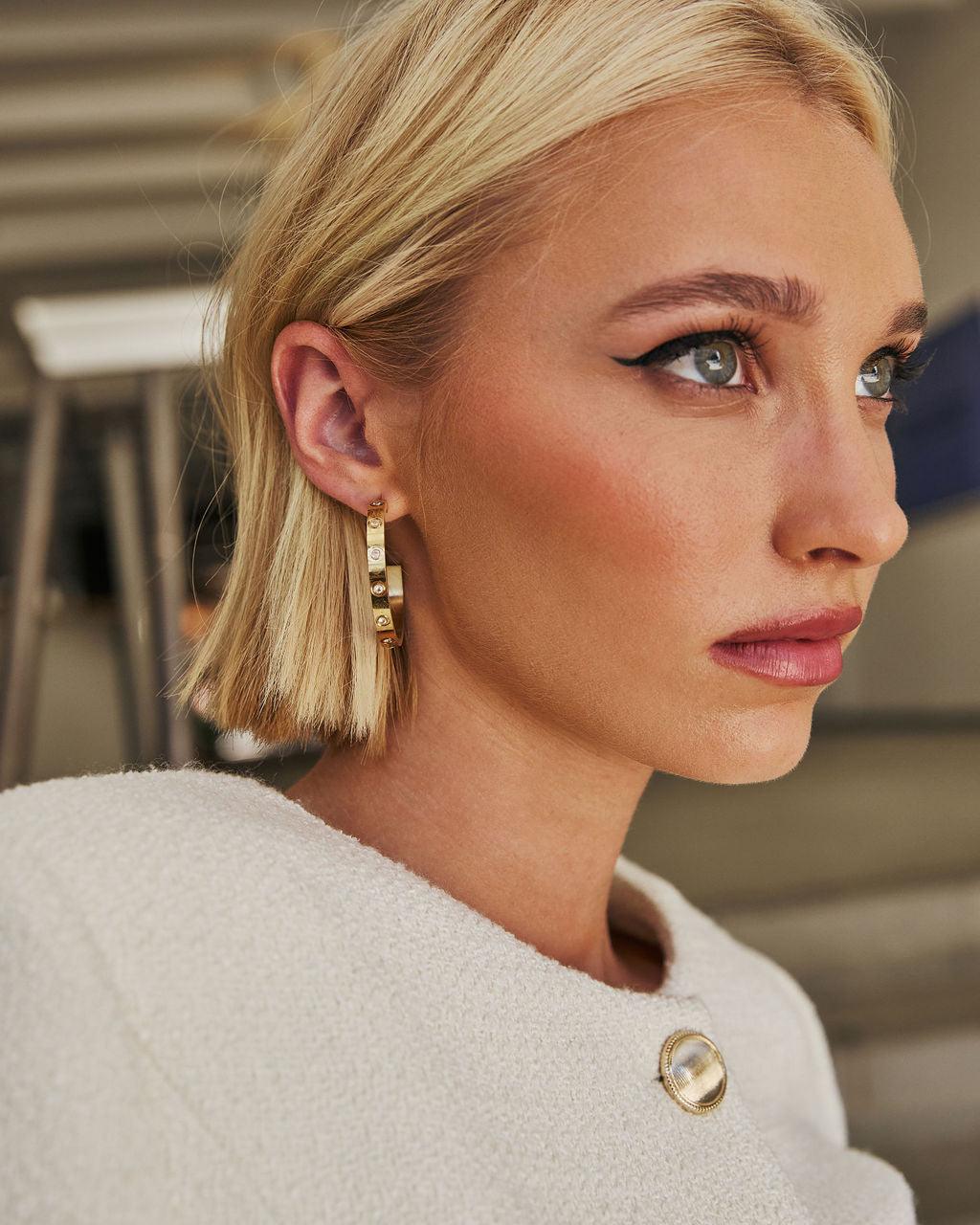 Aros con pedrería en Oro de 14k