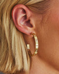 Aros con pedrería en Oro de 14k