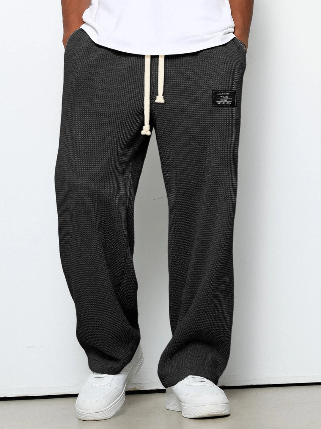 Pantalones con cintura ajustable y pierna ancha