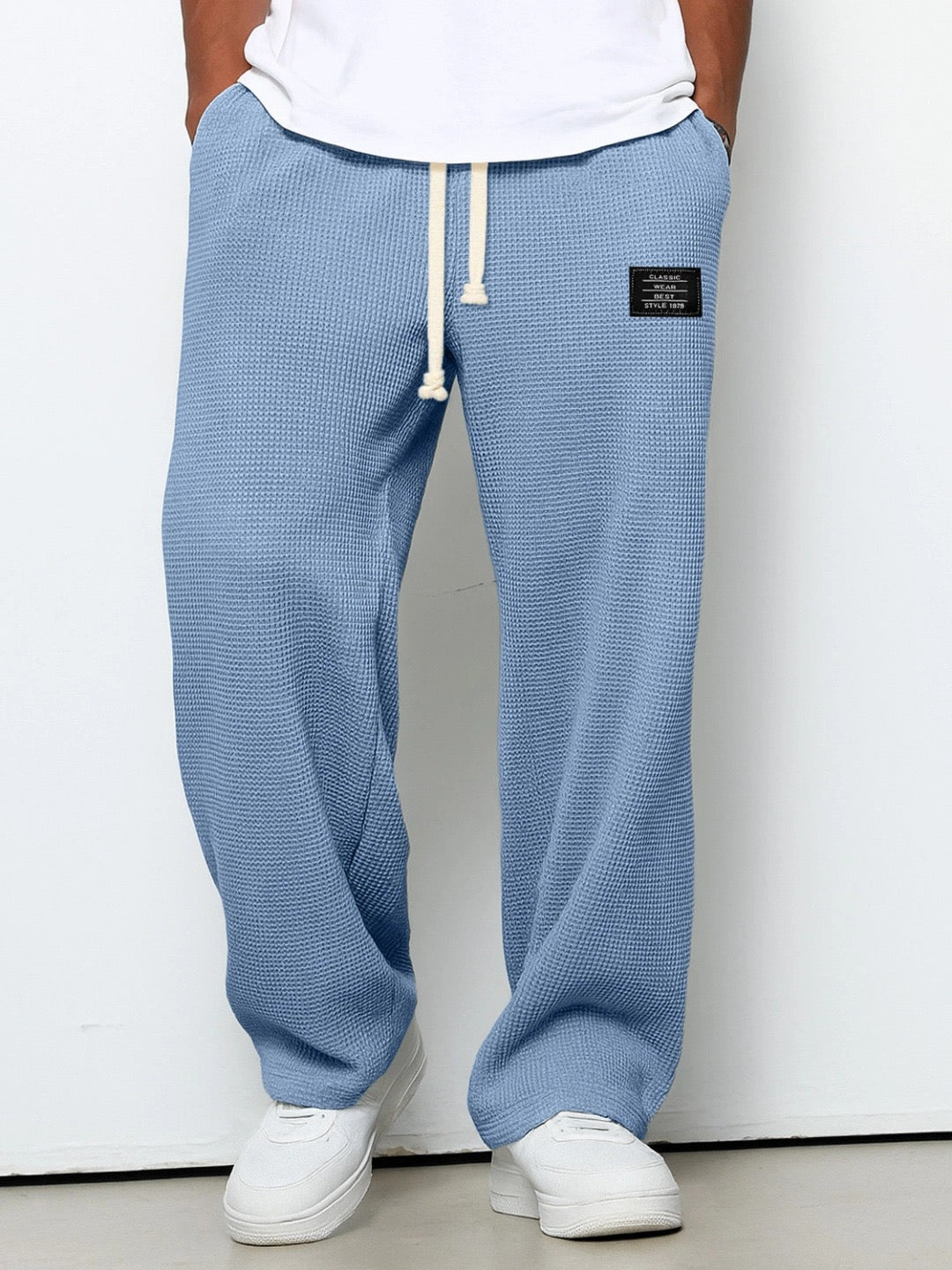 Pantalones con cintura ajustable y pierna ancha